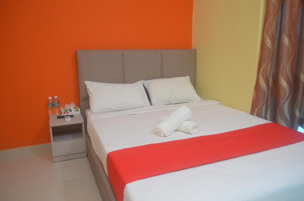 Postel nebo postele na pokoji v ubytování KL Empire Hotel KLIA, Formerly known as Adiff Palace KLIA