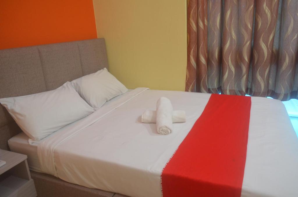Postel nebo postele na pokoji v ubytování KL Empire Hotel KLIA, Formerly known as Adiff Palace KLIA