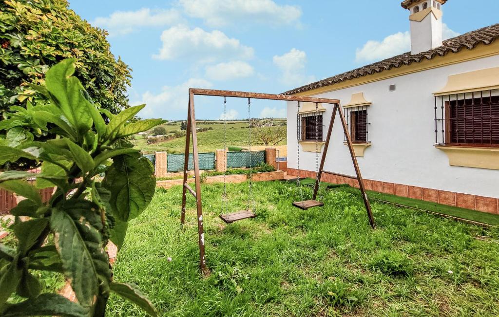 an empty swing set in the yard of a house at Mirador De Arcos in Arcos de la Frontera