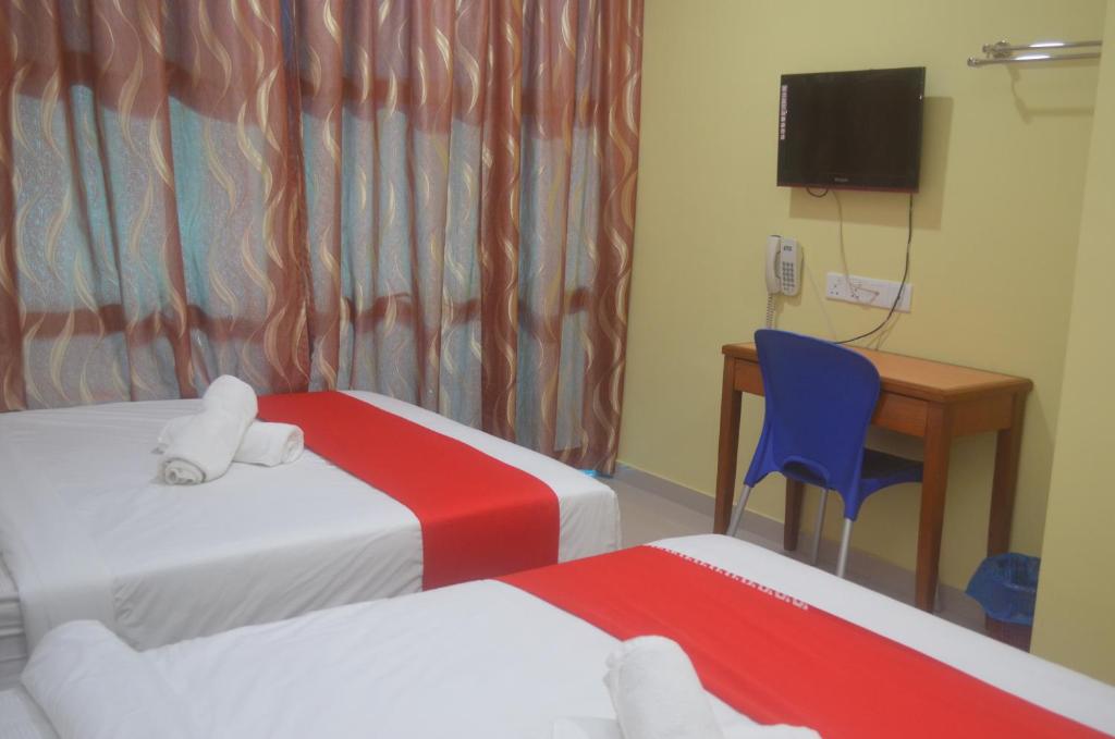 Postel nebo postele na pokoji v ubytování KL Empire Hotel KLIA, Formerly known as Adiff Palace KLIA