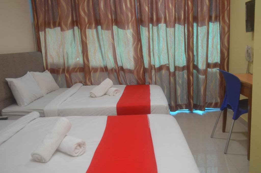 Postel nebo postele na pokoji v ubytování KL Empire Hotel KLIA, Formerly known as Adiff Palace KLIA