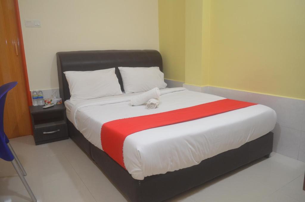 Postel nebo postele na pokoji v ubytování KL Empire Hotel KLIA, Formerly known as Adiff Palace KLIA