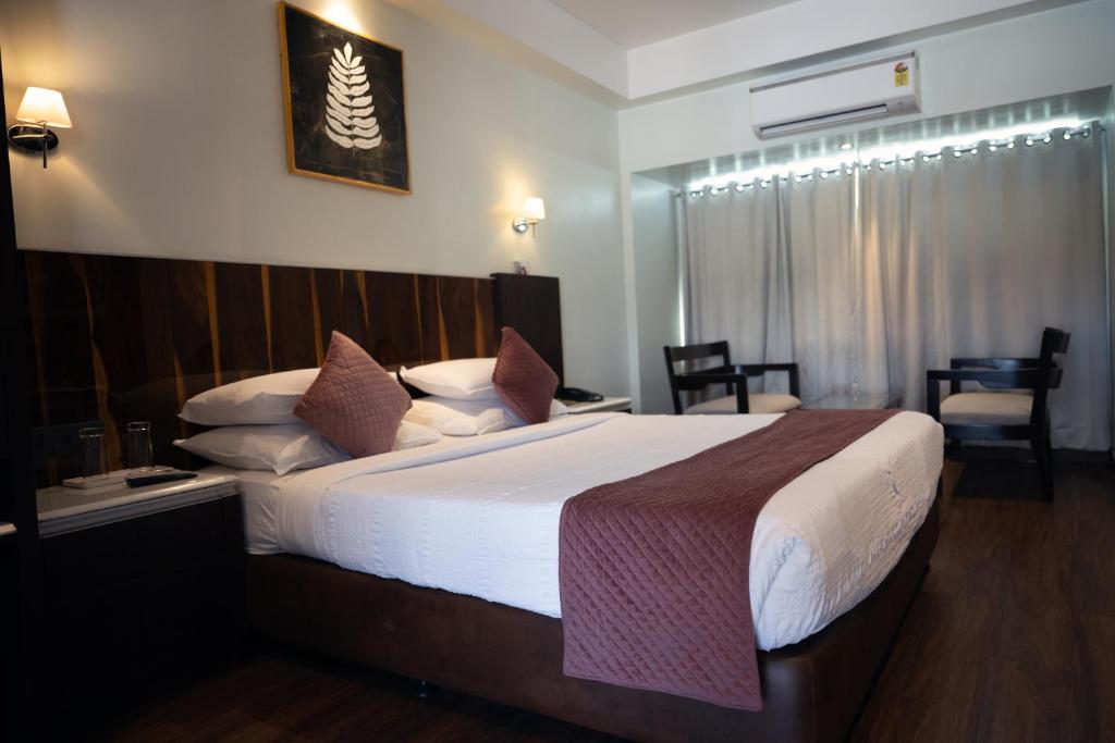 Postel nebo postele na pokoji v ubytování Hotel Holiday Resort
