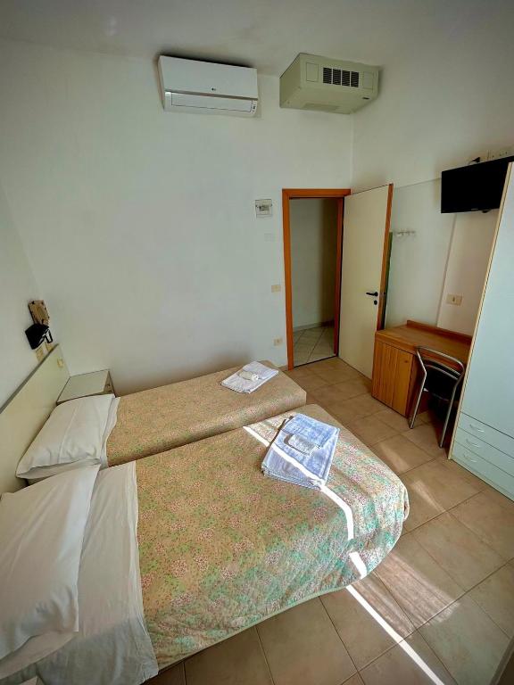 Postel nebo postele na pokoji v ubytování Hotel Sacramora