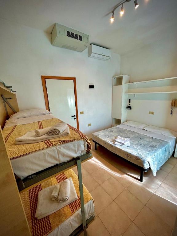 Postel nebo postele na pokoji v ubytování Hotel Sacramora