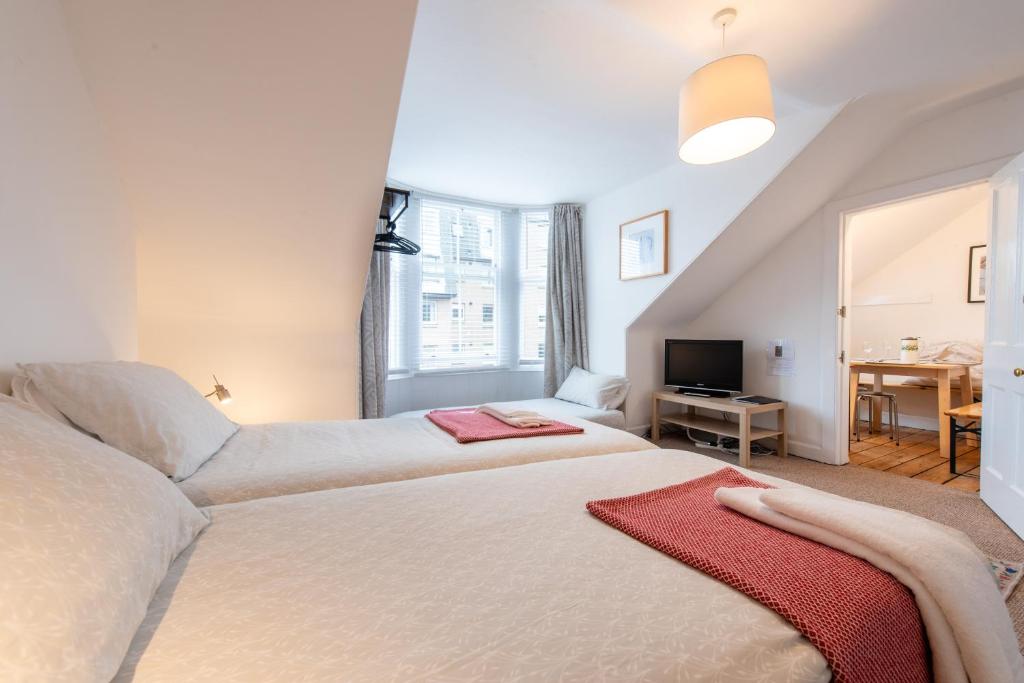 Postel nebo postele na pokoji v ubytování Sheens House