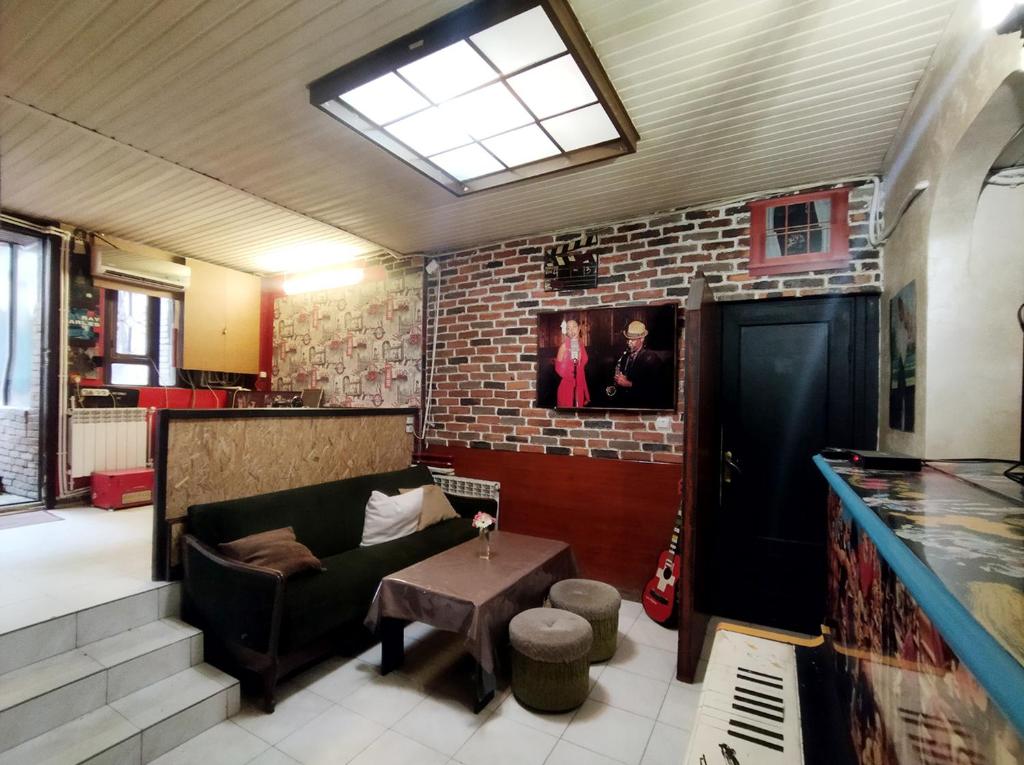 TV a/nebo společenská místnost v ubytování Grammy Hostel Residence
