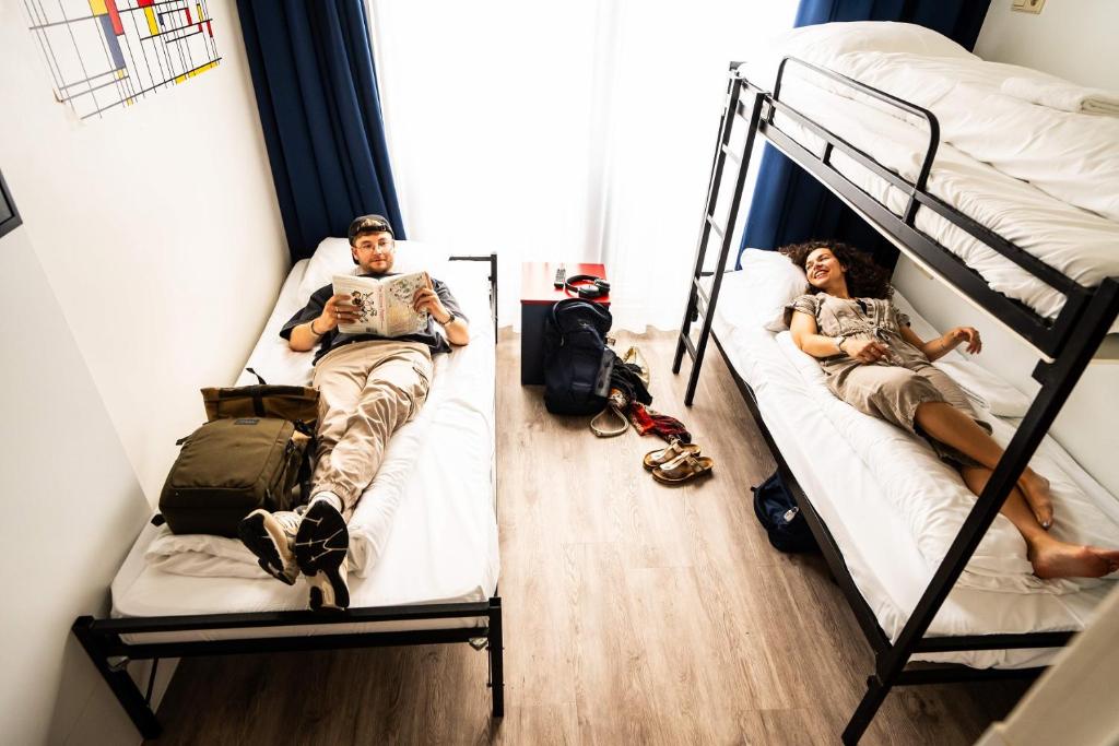 Postel nebo postele na pokoji v ubytování Bud Gett Hostels