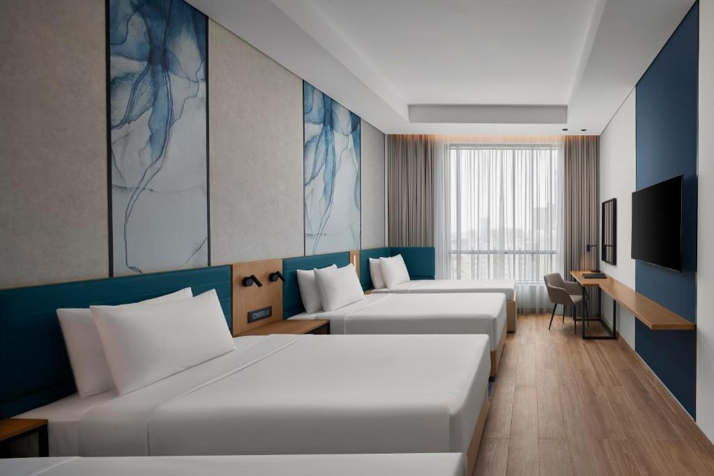 Courtyard by Marriott Makkahにあるベッド