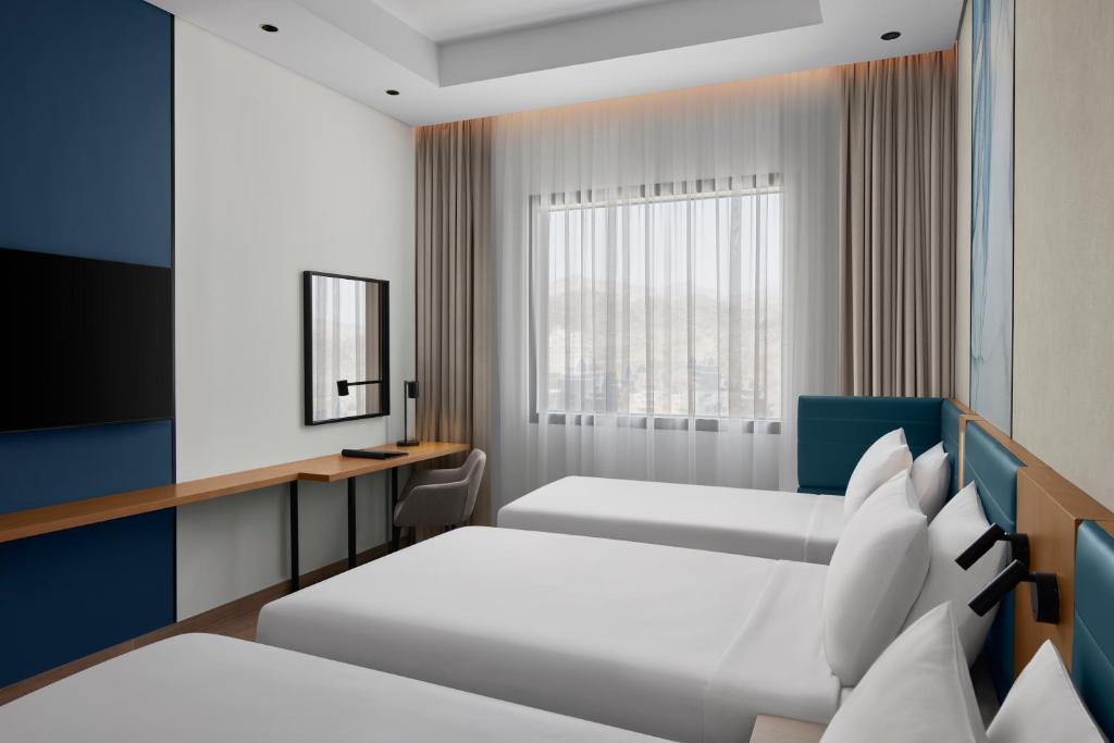 Courtyard by Marriott Makkahにあるベッド