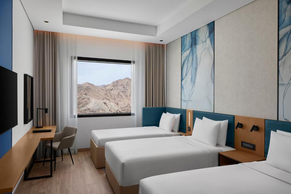 Courtyard by Marriott Makkahにあるベッド