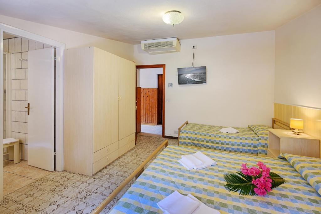 Postel nebo postele na pokoji v ubytování Hotel Casa Rosa