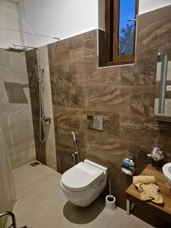 Koupelna v ubytování Aliya Lanka