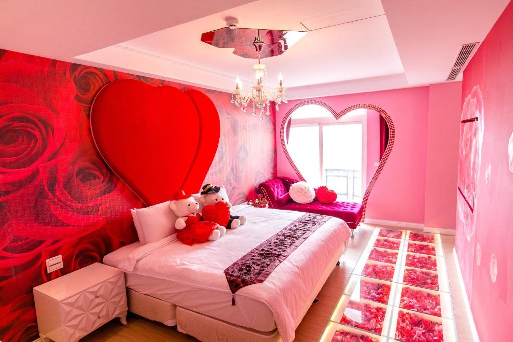 Postel nebo postele na pokoji v ubytování Jin Pin Hotel