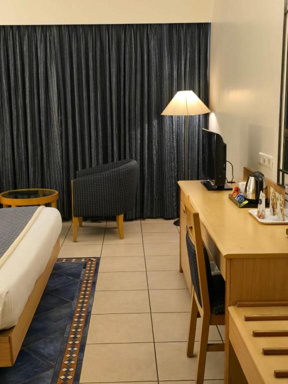 Postel nebo postele na pokoji v ubytování Harrisons Hotel