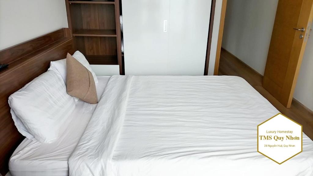 Giường trong phòng chung tại TMS Quy Nhơn Luxury Homestay