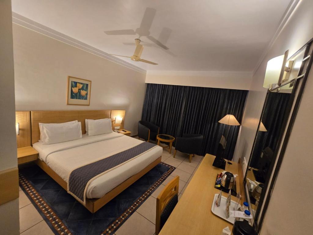 Postel nebo postele na pokoji v ubytování Harrisons Hotel