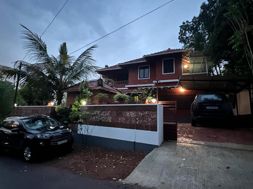 a house with a car parked in front of it at Krishnalayam Heritage Villa in Elimala