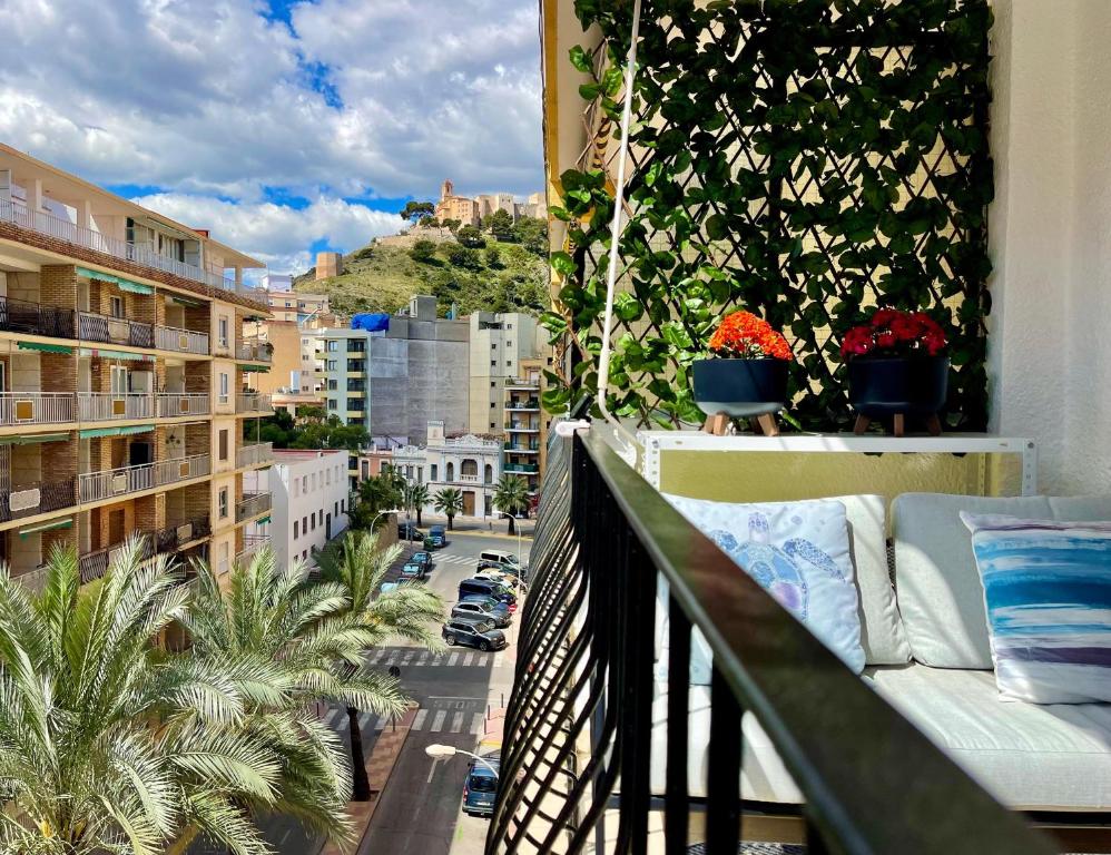 a balcony with a view of a city at Apartamento Mar y Montaña in Cullera