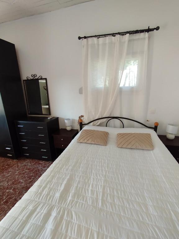 Postel nebo postele na pokoji v ubytování Villa Cottage Eleni