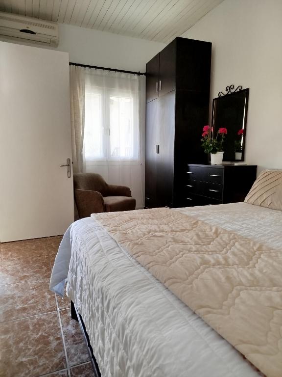 Postel nebo postele na pokoji v ubytování Villa Cottage Eleni