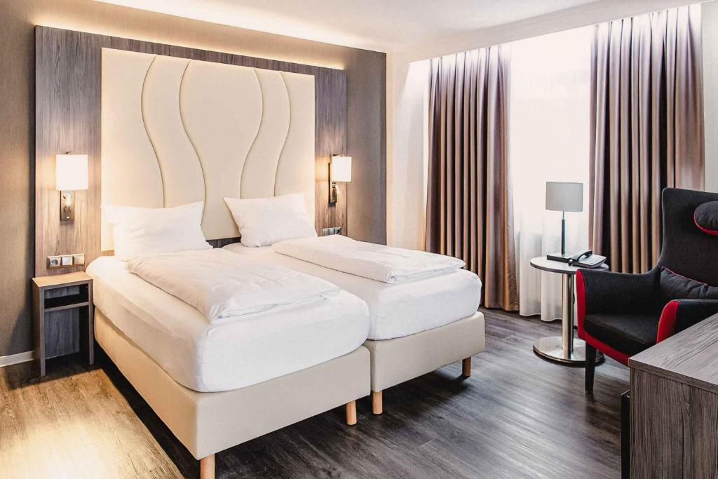 Postel nebo postele na pokoji v ubytování PLAZA Hotel Buchhorner Hof