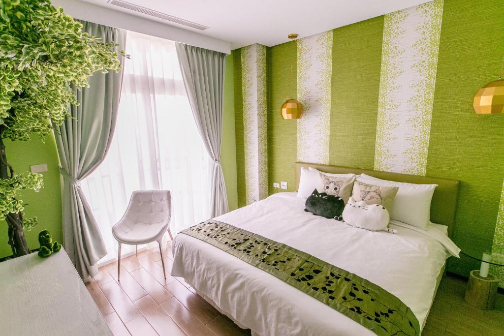 Postel nebo postele na pokoji v ubytování Jin Pin Hotel