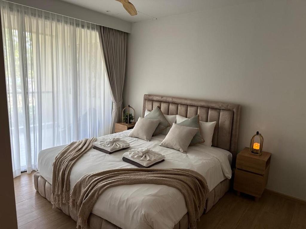 Ένα ή περισσότερα κρεβάτια σε δωμάτιο στο Laguna Beachside Residences 2bdr