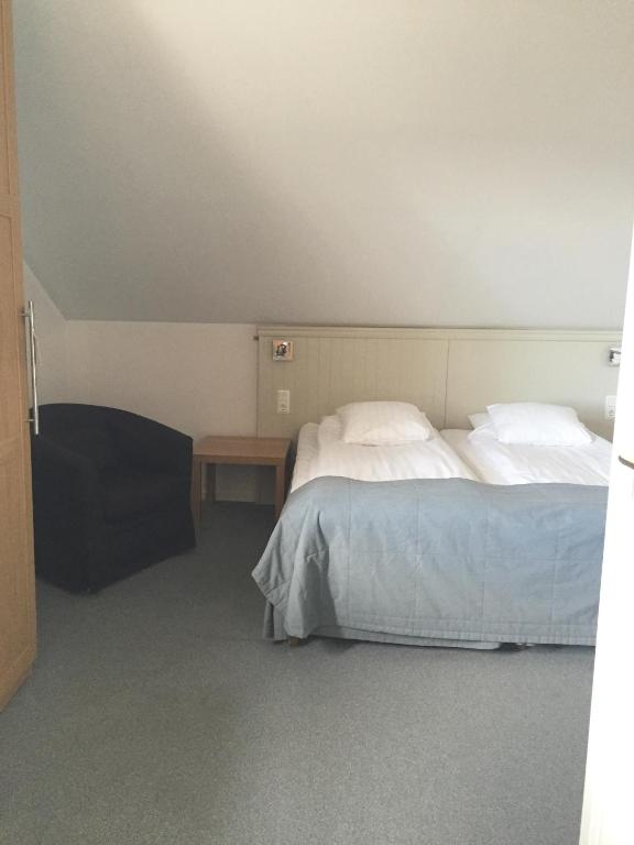 Postel nebo postele na pokoji v ubytování Adels Hotel