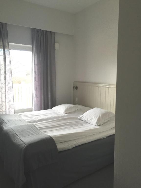 Postel nebo postele na pokoji v ubytování Adels Hotel