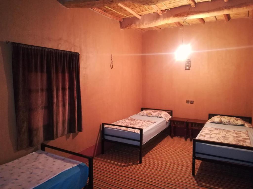 Postel nebo postele na pokoji v ubytování Gite Amoudou