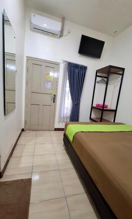 Letto o letti in una camera di Anjuma Backpacker