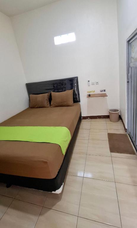 Letto o letti in una camera di Anjuma Backpacker