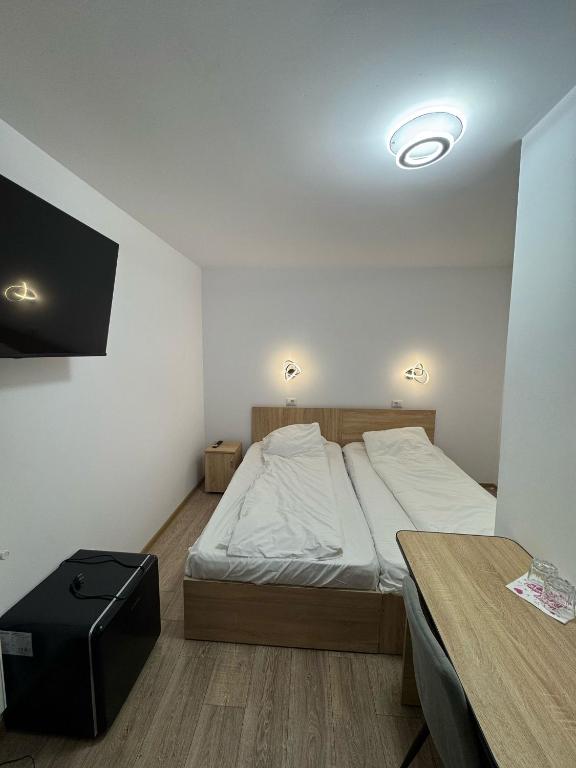 Postel nebo postele na pokoji v ubytování Pensiunea Arieș
