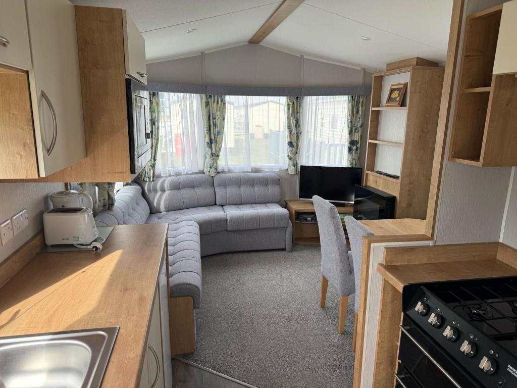 a kitchen and living room in a caravan at Glenlea in Selsey