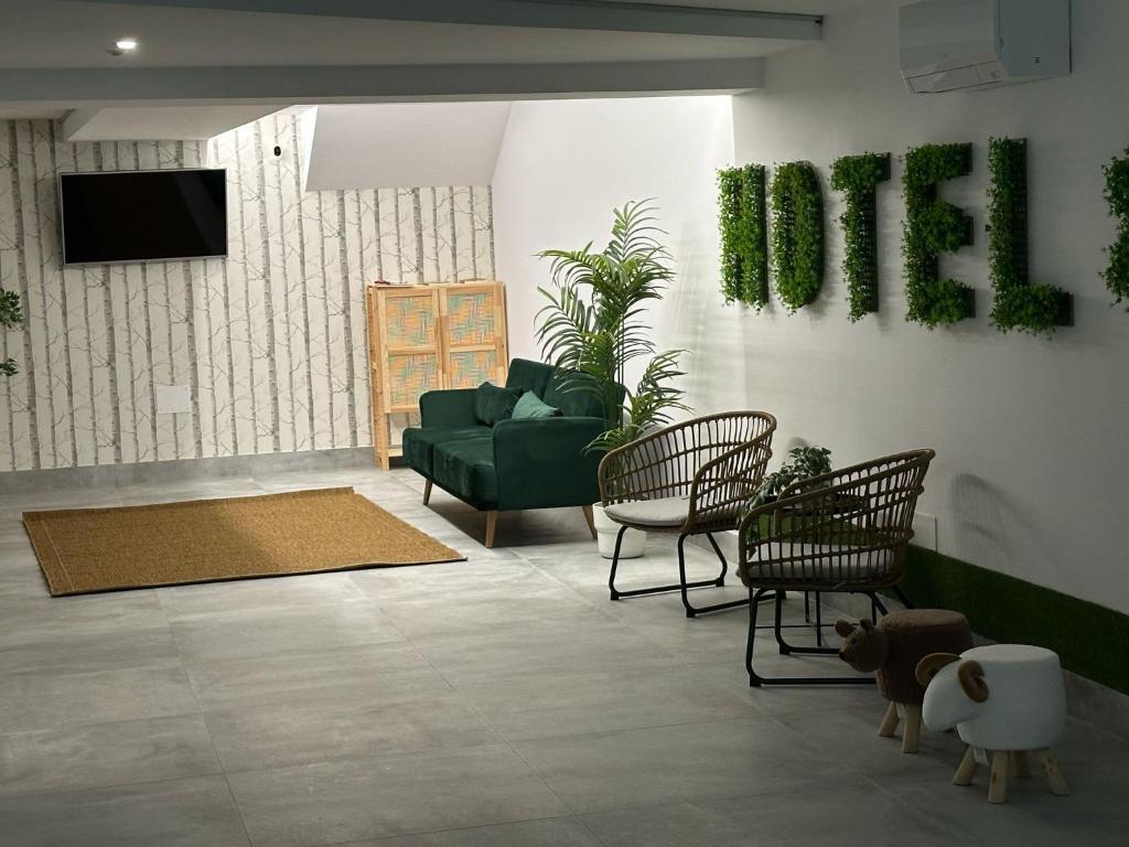 TV a/nebo společenská místnost v ubytování Hotel Playa de Sardiñeiro