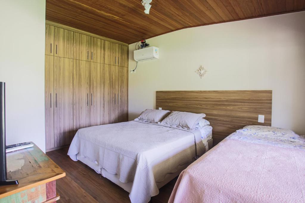 Postel nebo postele na pokoji v ubytování Villaggio dos Pássaros