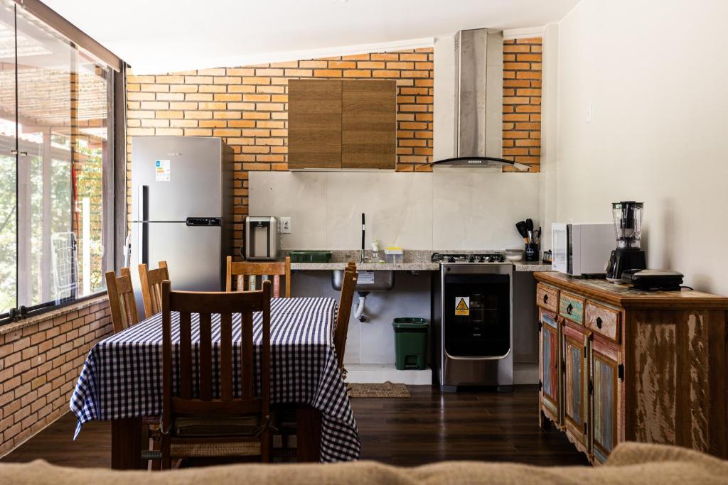Kuchyň nebo kuchyňský kout v ubytování Villaggio dos Pássaros