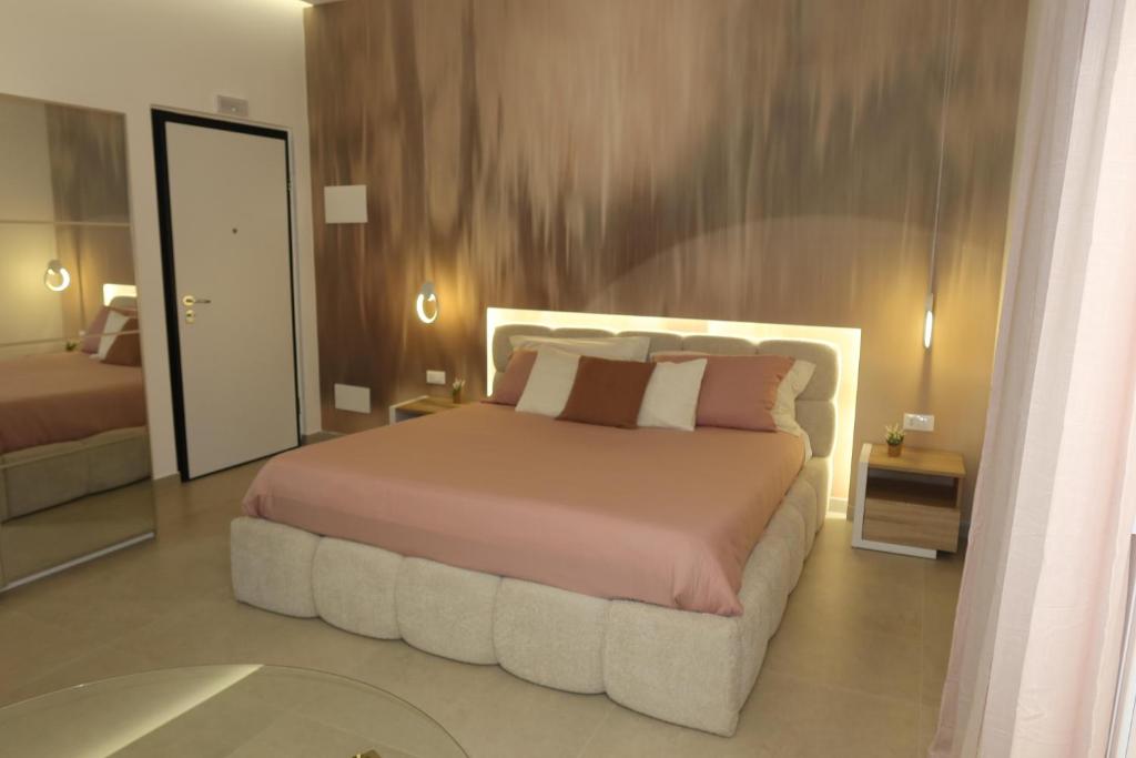 Ένα ή περισσότερα κρεβάτια σε δωμάτιο στο Suites Domus Fysi