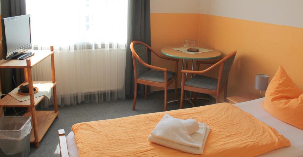 Postel nebo postele na pokoji v ubytování Hotel Ratscafe Ückeritz