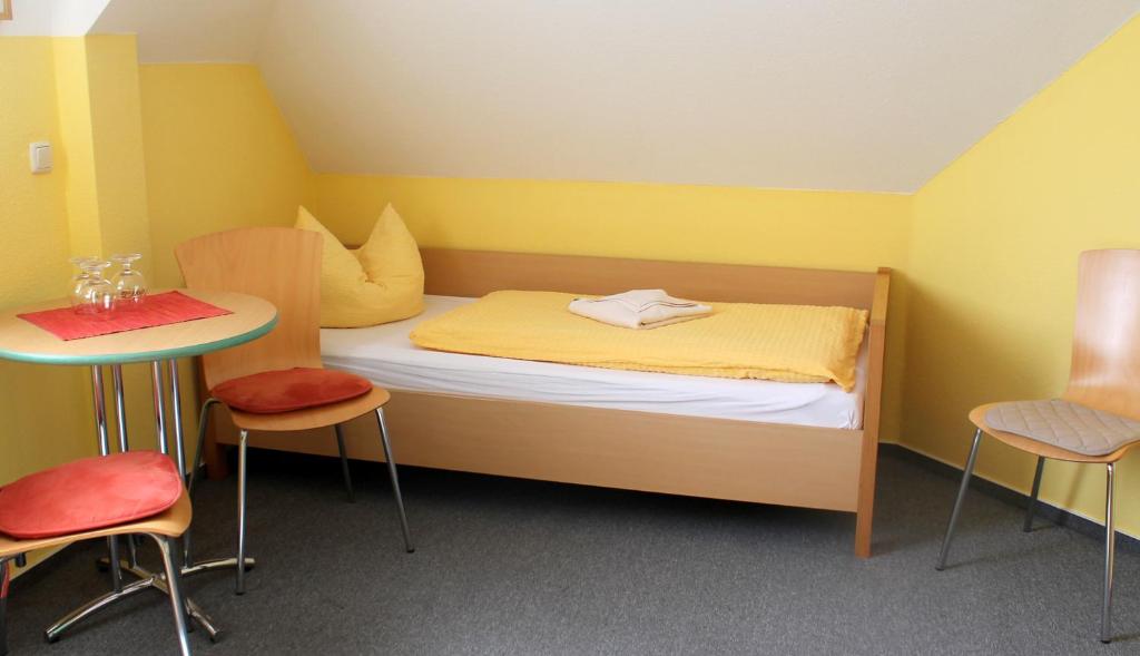 Postel nebo postele na pokoji v ubytování Hotel Ratscafe Ückeritz
