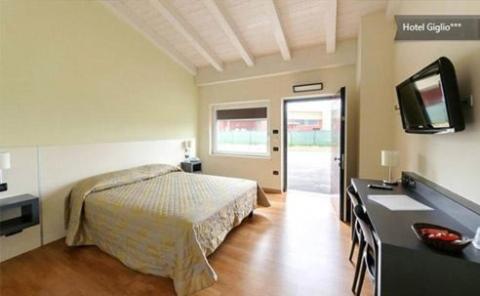 Postel nebo postele na pokoji v ubytování Hotel Motel Giglio
