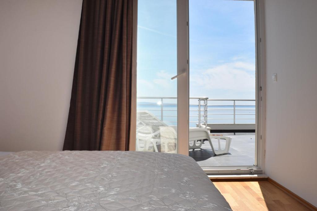 Posteľ alebo postele v izbe v ubytovaní Apartments King