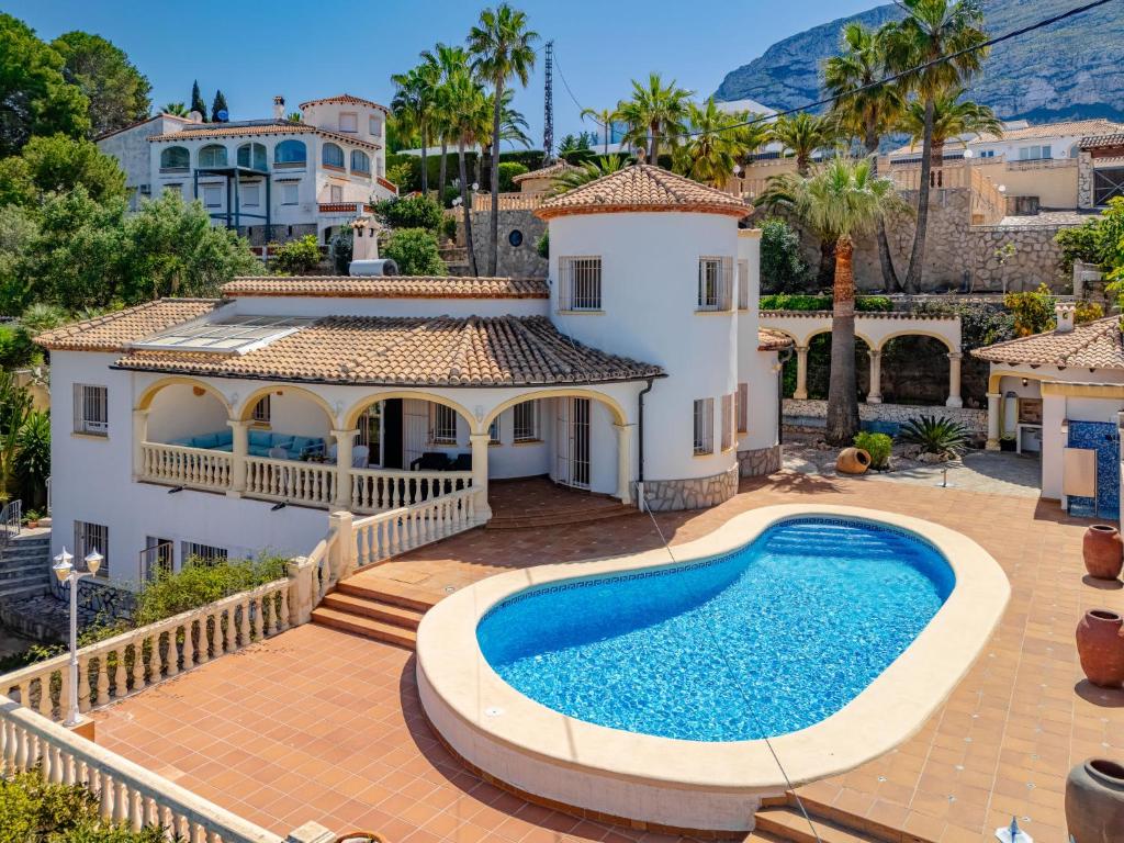 a villa with a swimming pool and a house at Villa Villa Rosa by Interhome in Denia