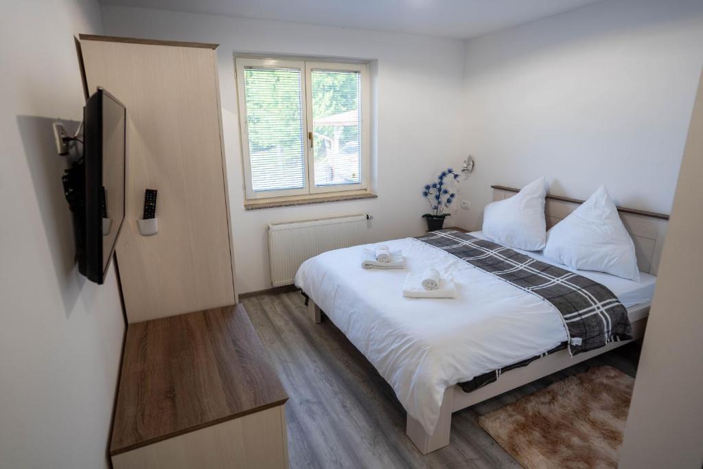 Postel nebo postele na pokoji v ubytování OPG Lukaček