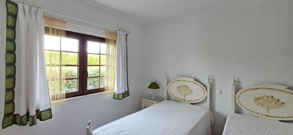 Cama ou camas em um quarto em Apartamento Neptuno