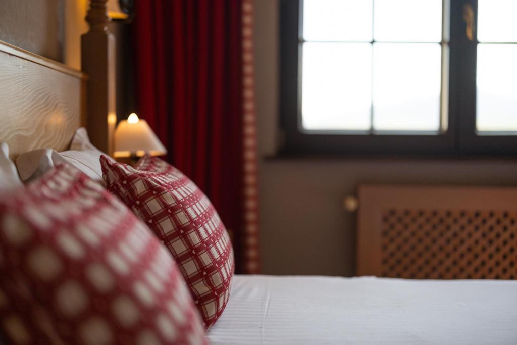 Postel nebo postele na pokoji v ubytování Hôtel Arnold