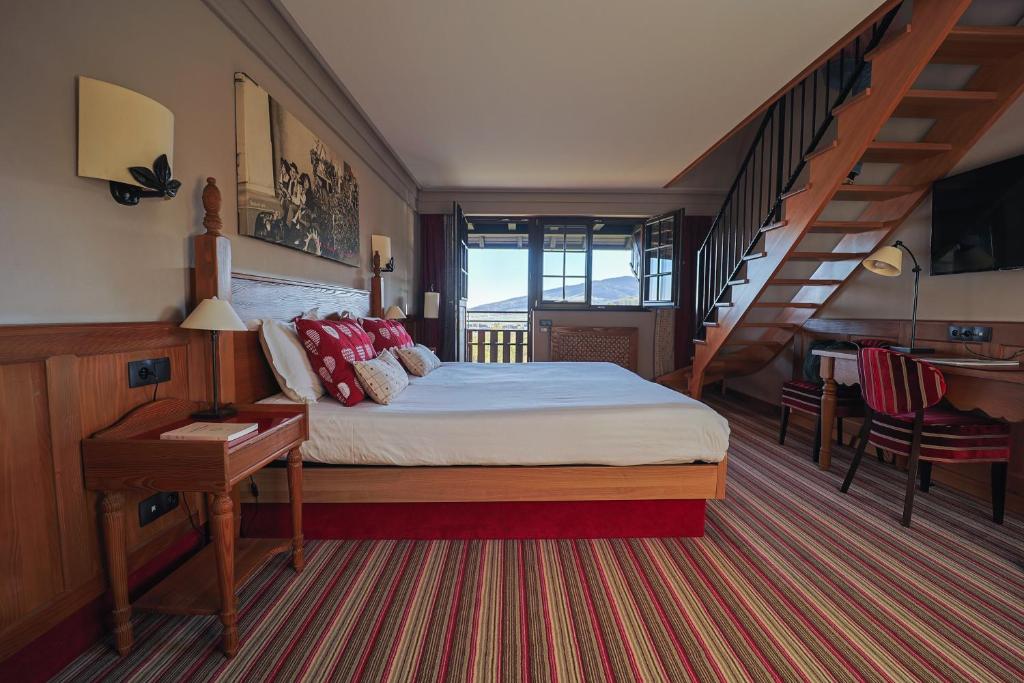 Postel nebo postele na pokoji v ubytování Hôtel Arnold