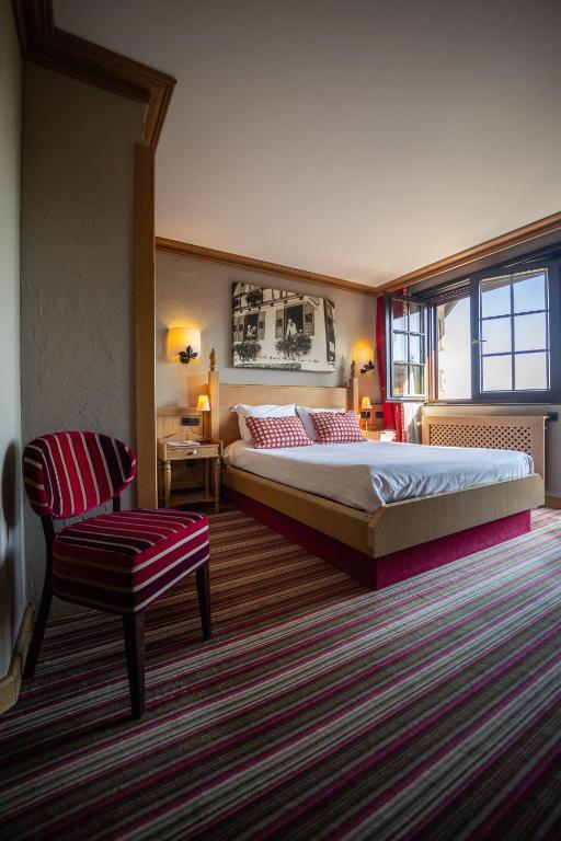 Postel nebo postele na pokoji v ubytování Hôtel Arnold