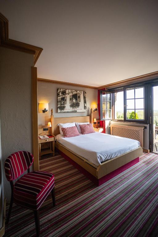 Postel nebo postele na pokoji v ubytování Hôtel Arnold
